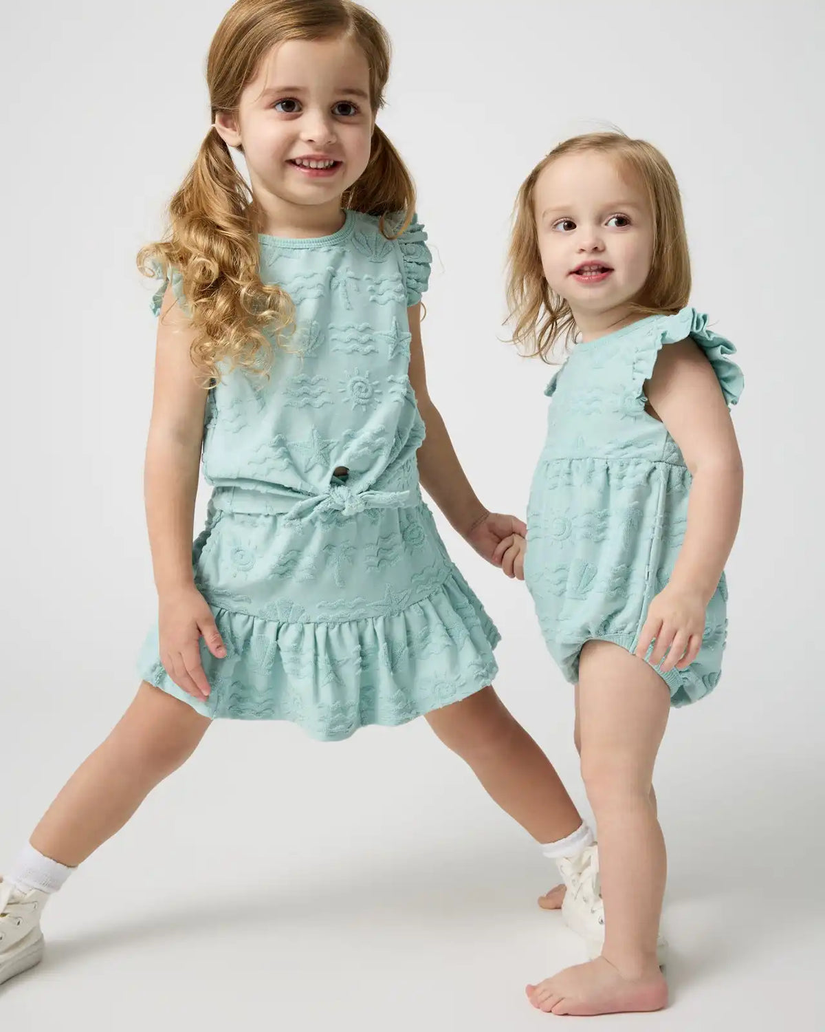 Coastal Rays Bow Front Flutter Top